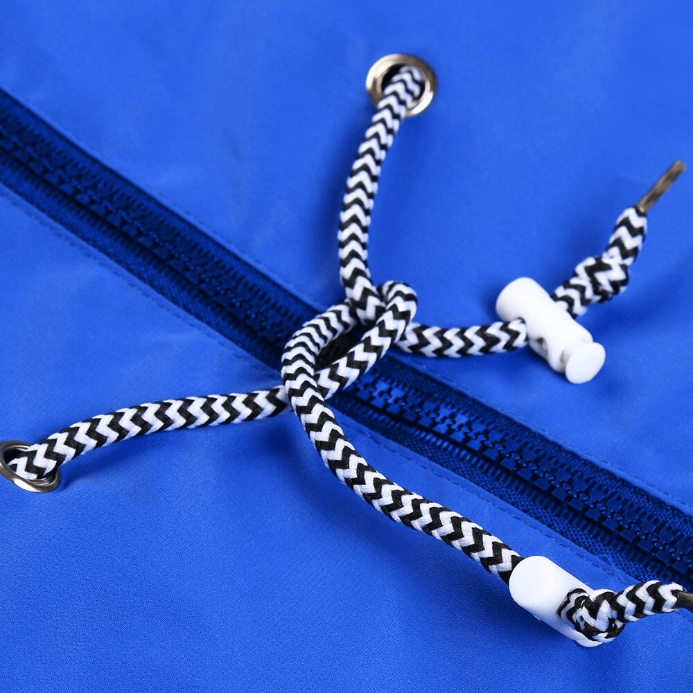 Close-up of waterproof jacket's blue fabric with black and white drawstring